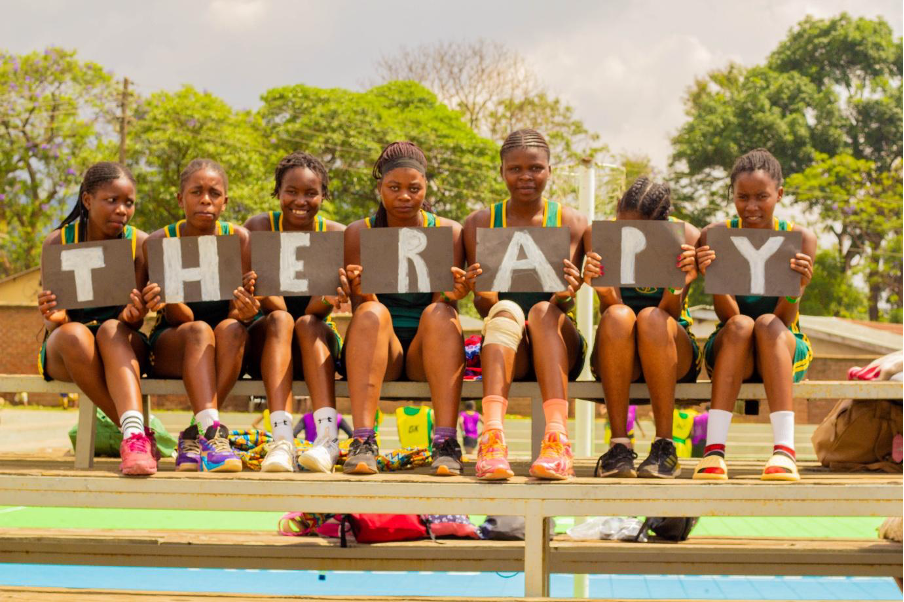 Netball players with placards